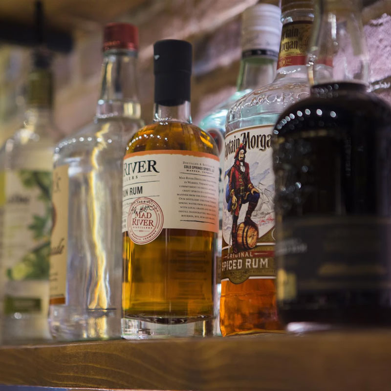 A close up of alcohol bottles on the bar