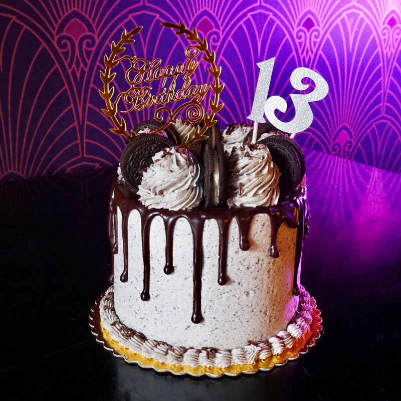 Cookies and creme birthday cake with chocolate drizzle